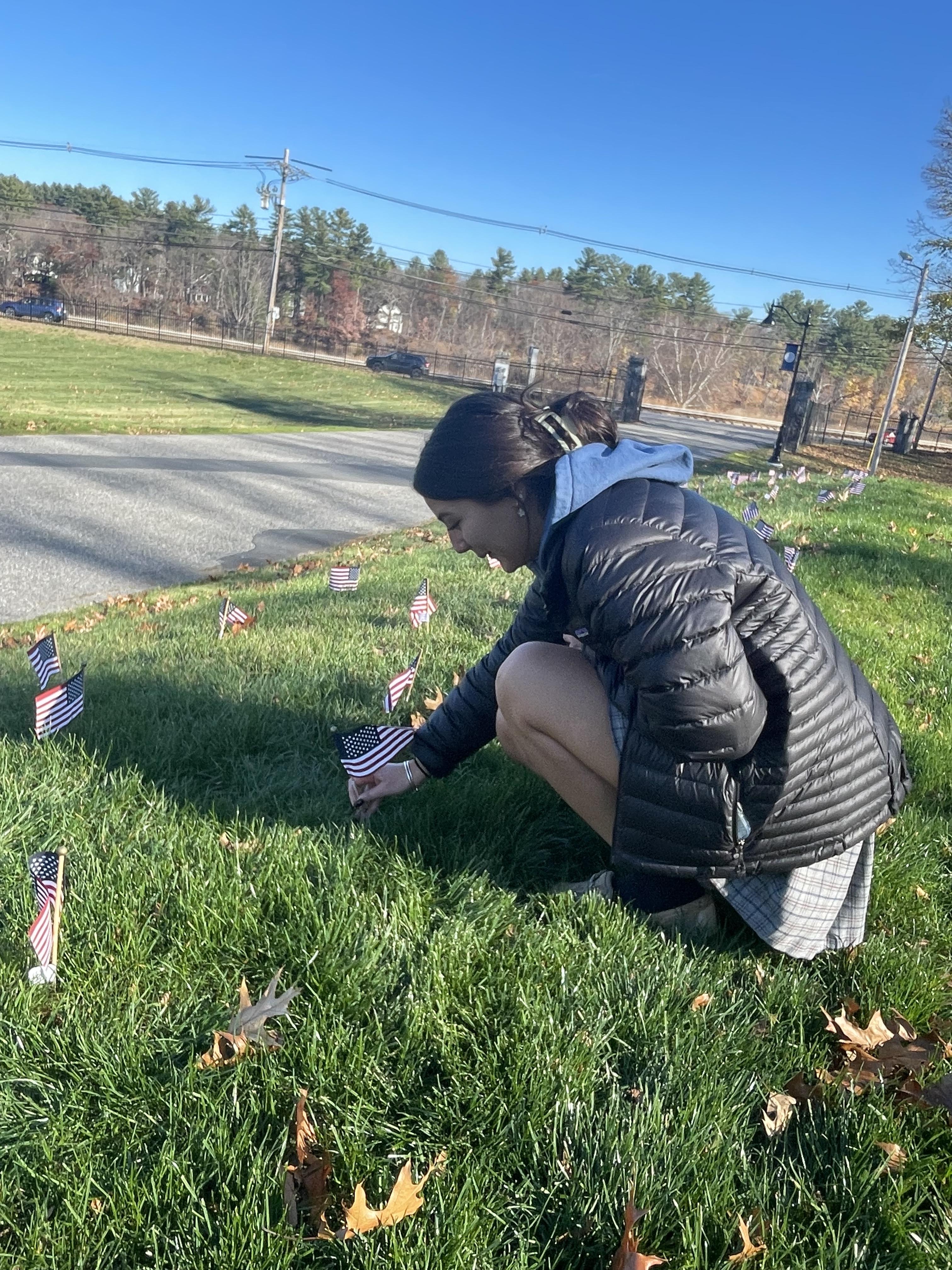 Student planting flag
